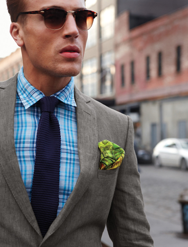 Gray jacket with green paisley square.