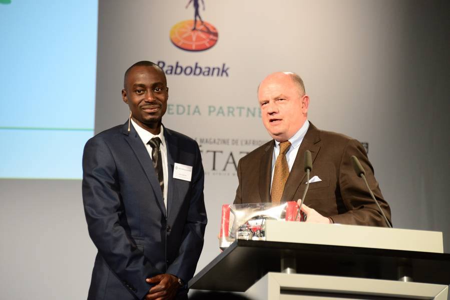 Kaahwa receives a replica of the Massey Ferguson Award winning 2012 Tractor model designed for African conditions from the C.E.O of AGCO Corporation.