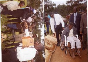 Grandson Andrew Ankunda Kikira and Rwakakamba distributing wheel Chairs and condoms in 2005. Kosiya Kikira witnessed the function